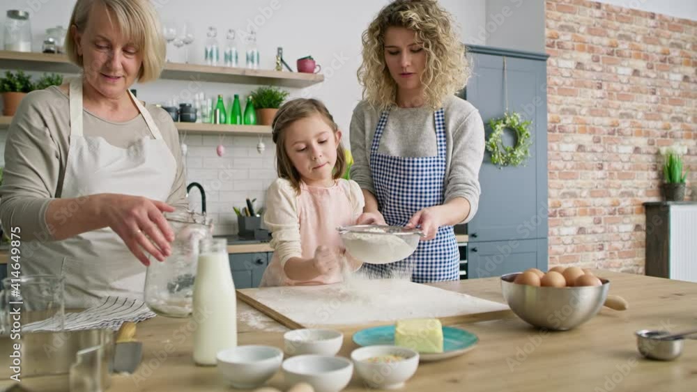 Video of women sift the flour for easter bake. Shot with RED helium camera in 8K. Video of women sift the flour for easter bake. Shot with RED helium camera in 8K.