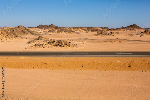 Road in the sahara desert of Egypt. Conceptual for freedom, enjoying the journey. Empty road. Freeway, Highway through the desert