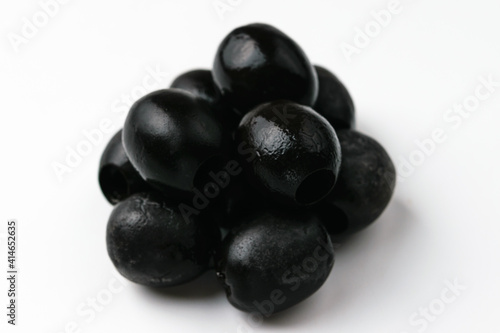 Black olives on a white background