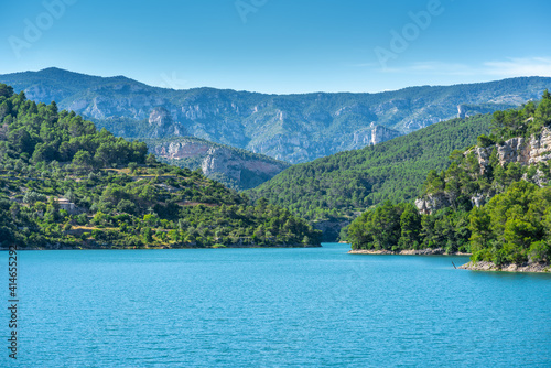 Reservoir full of water amidst a mountain landscape Ulldecona, Comunidad Valenciana, Spain