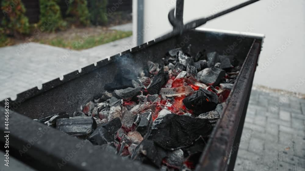 Burning coal in iron brazier. Preparation for barbecue.
