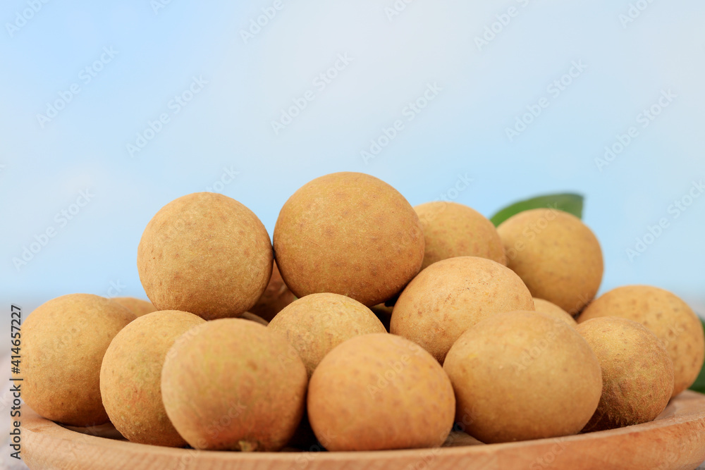 Longan is on the wooden table Longan is on the wooden table