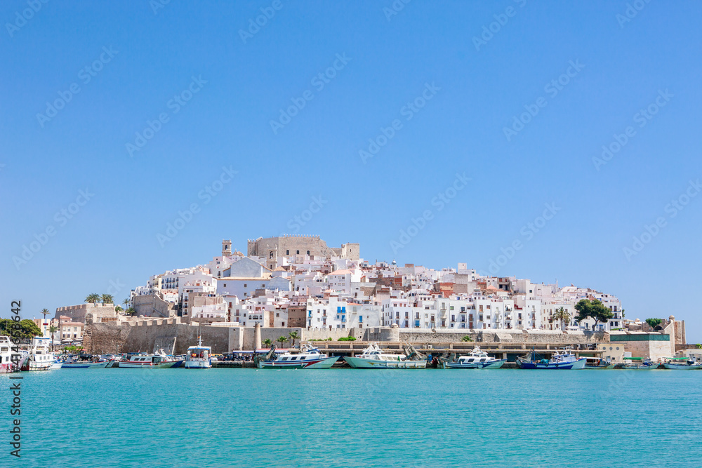 Beautiful village reflected on still water. Famous place Peniscola or Peñiscola on the Mediterranean. Templar Castle.