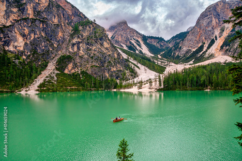 Lake Braies (Lake Prags or Pragser Wildsee) is a lake in the Prags Dolomites in South Tyrol, Italy. Hiking travel and adventure.