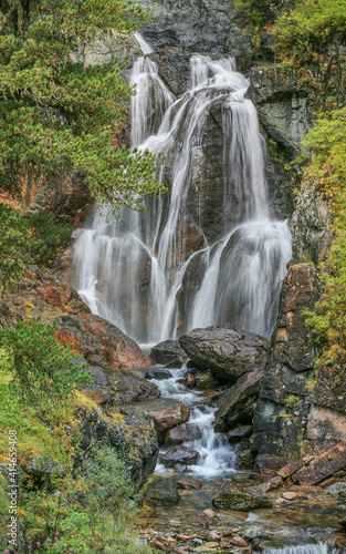 Picturesque waterfall in the wild mountains of Siberia