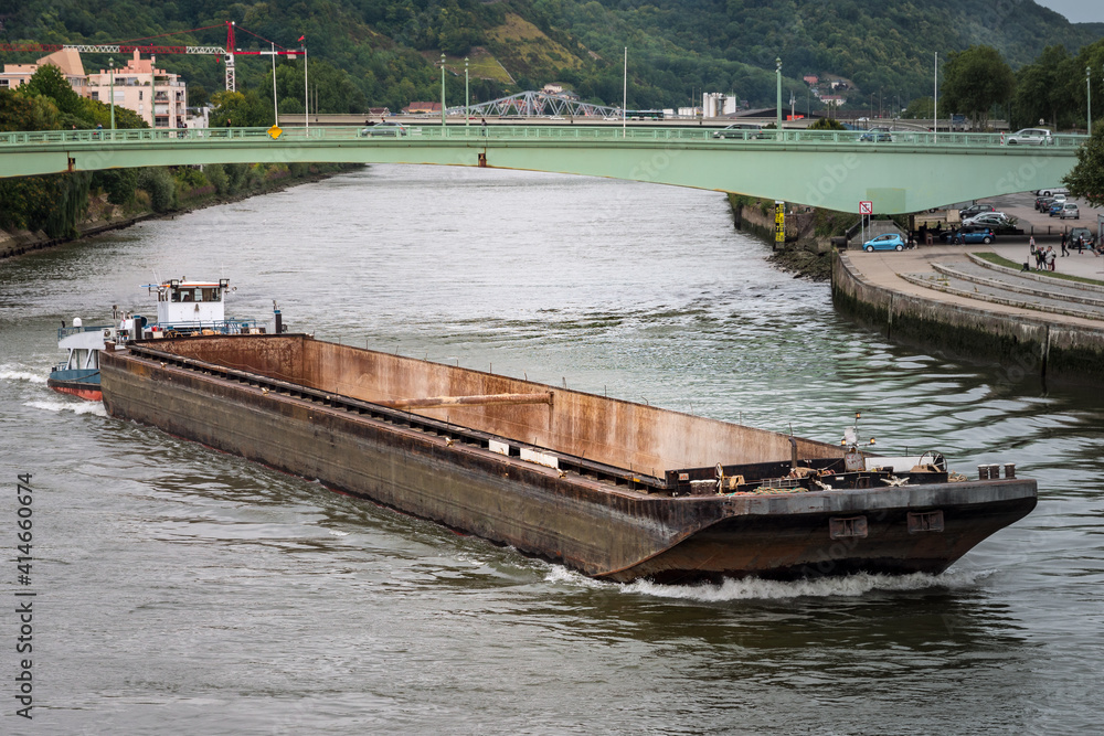 Unloaded river freight barge on the river Seine. Rouen, France.