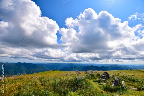 It is a vast landscape of Shikoku Karst. There are lots of big white rocks.