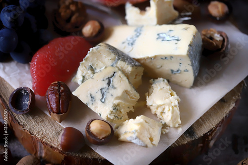 Gorgonzola cheese with nuts and fruits. Cheese plate. Wine appetizer.