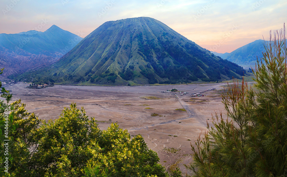 Indonesia. Java island. Mount Bromo.
 The mountain is part of the national volcanic park Bromo Tengger Semeru National Park, its height is 2329 meters. The slopes are covered with evergreen trees. 
