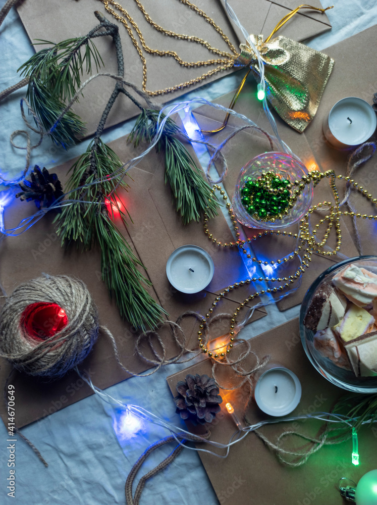 Photo New Year's flat ley. Christmas background. colorful decorations. new year multi-colored illumination. craft bags