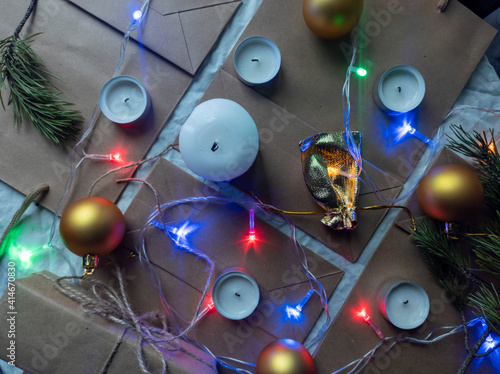 Obraz na płótnie Photo New Year's flat ley. Christmas background. colorful decorations. new year multi-colored illumination. craft bags w salonie