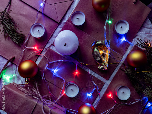 Obraz na płótnie Photo New Year's flat ley. Christmas background. colorful decorations. new year multi-colored illumination. craft bags w salonie
