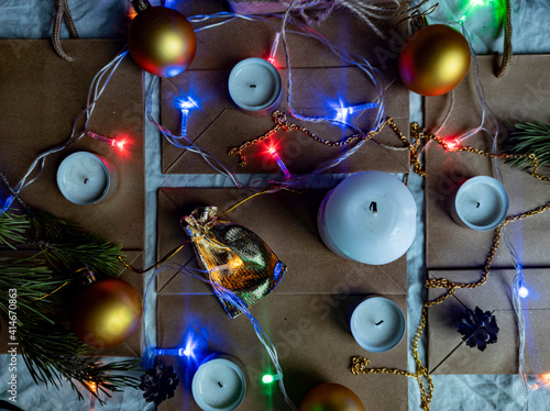 Obraz na płótnie Photo New Year's flat ley. Christmas background. colorful decorations. new year multi-colored illumination. craft bags w salonie