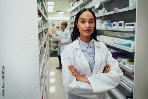 Portrait of professional female pharmacist in modern drugstore