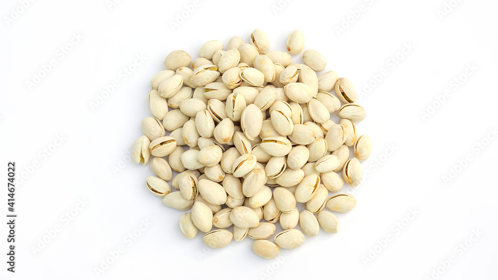 Pistachio nuts on a white background. Pistachio nuts on a white background.