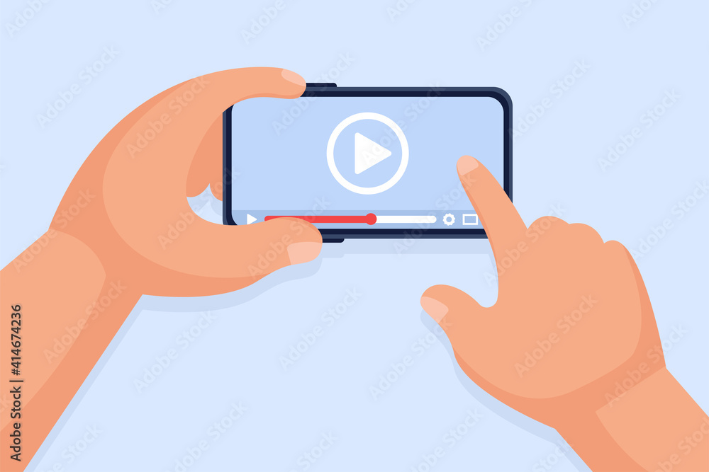 Hands hold a smartphone and touch the screen. Video player on the screen. Video content marketing concept. Online training, video conferencing and webinars, publishing information in video.