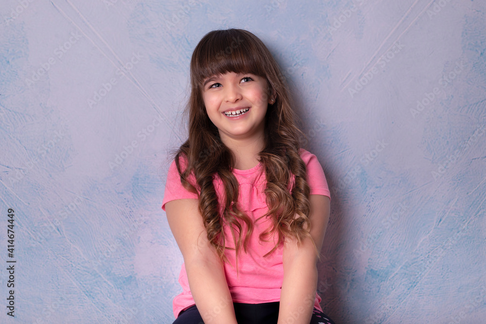 Headshot portrait of happy little girl posing in studio Headshot portrait of happy little girl posing in studio
