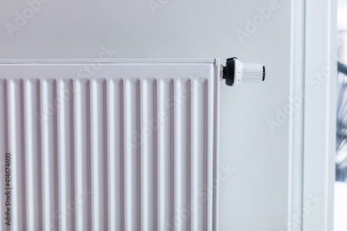 Wallpaper Mural White radiator with temperature control valve. Central heating battery. Torontodigital.ca
