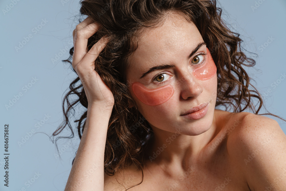 Beautiful half-naked nice girl posing with eye patches Beautiful half-naked nice girl posing with eye patches