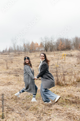 LGBT lesbian couple love moments happiness concept. A walk in nature