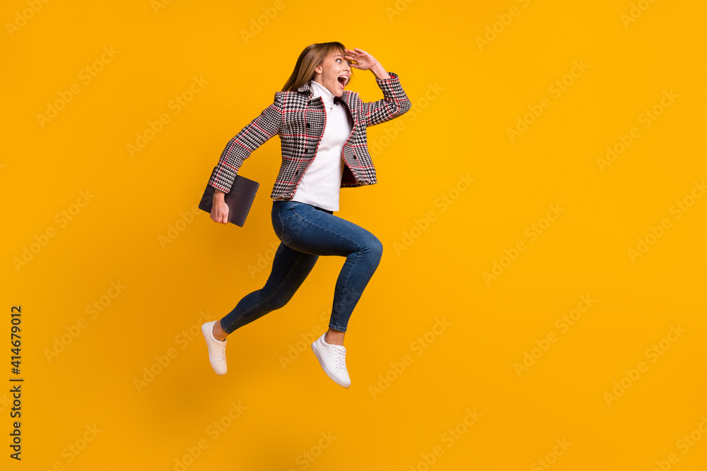 Full size profile portrait of astonished girl hand on forehead look empty space isolated on yellow color background Full size profile portrait of astonished girl hand on forehead look empty space isolated on yellow color background