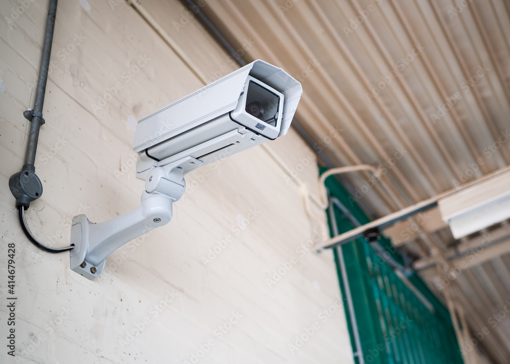 Prison communal room jail in sunlight of high security run down immigration  detention centre in England with professional CCTV security camera  monitoring the room activity Stock Photo | Adobe Stock