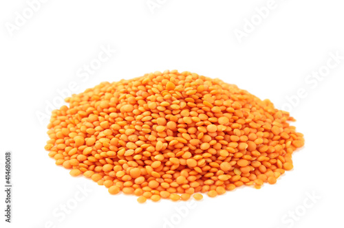 Red lentils isolated on a white background.