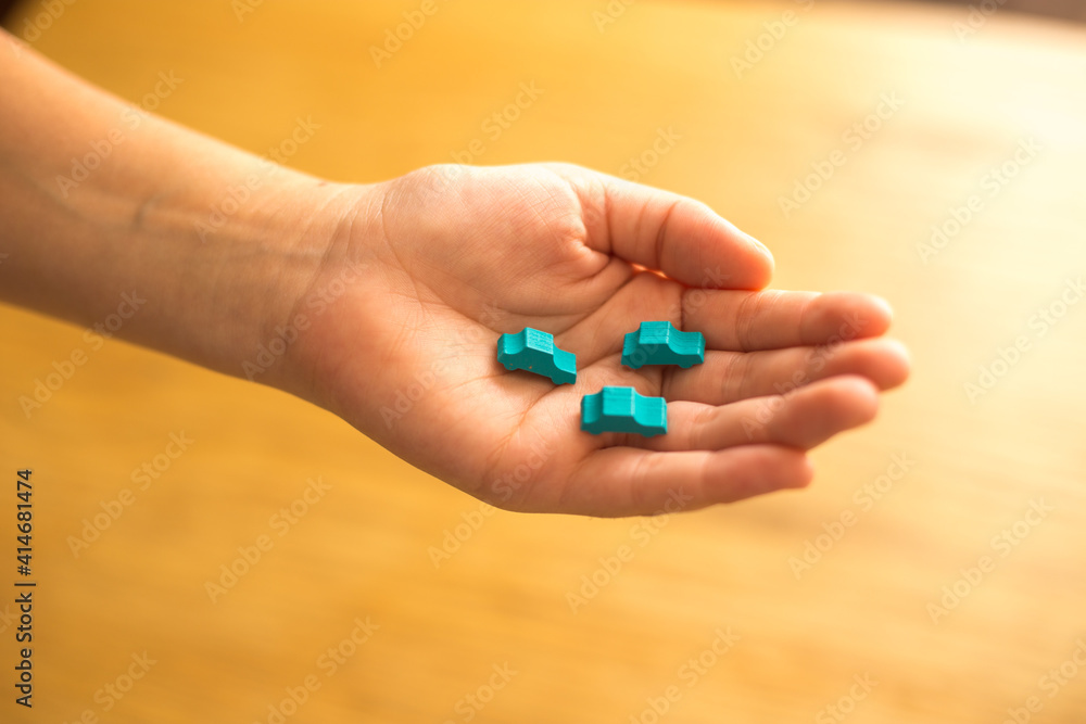 Hand protecting cars from toys. Insurance and car safety concept Hand protecting cars from toys. Insurance and car safety concept