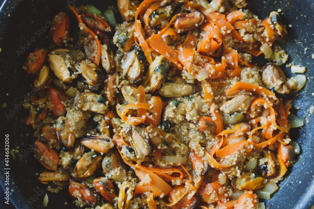 Cooking of traditional Moroccan couscous with mussels. Cooking of traditional Moroccan couscous with mussels.