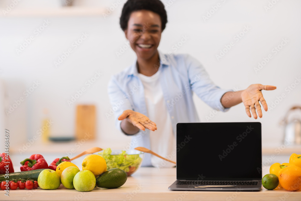 Black Lady Showing Laptop With Blank Screen In Kitchen, Mockup Black Lady Showing Laptop With Blank Screen In Kitchen, Mockup