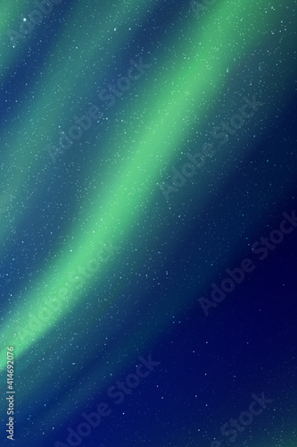 Night starry sky and Northern lights. Green aurora borealis