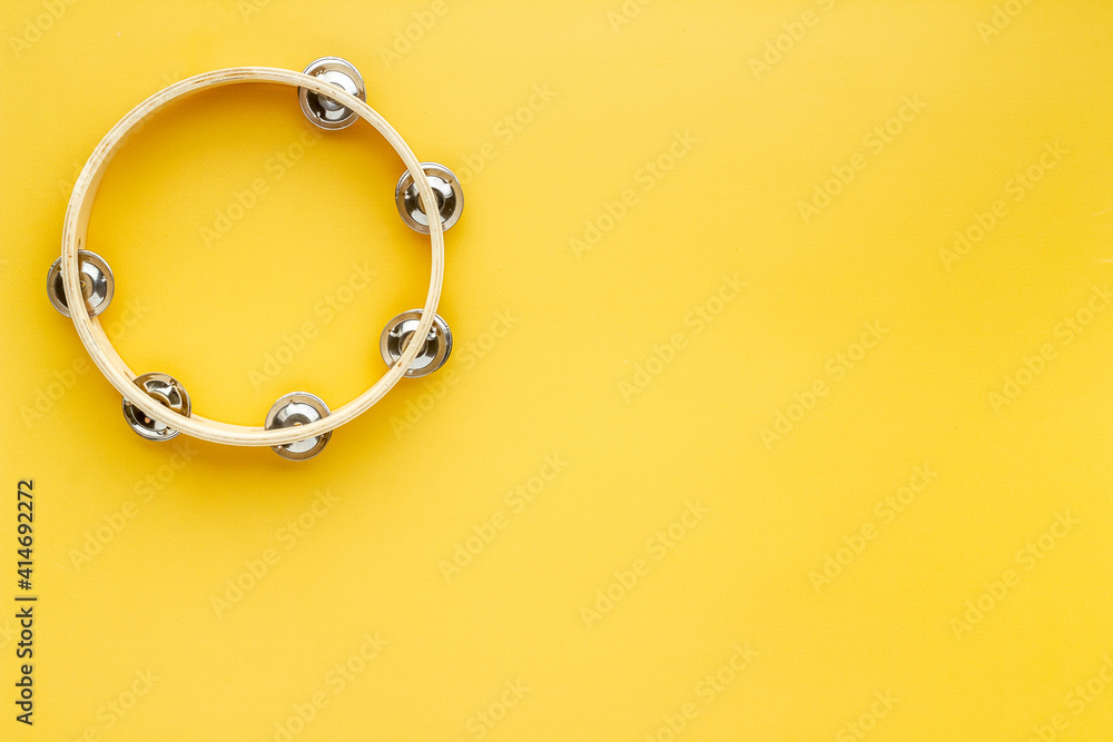 Percussion instrument tambourine, top view. Music background Percussion instrument tambourine, top view. Music background