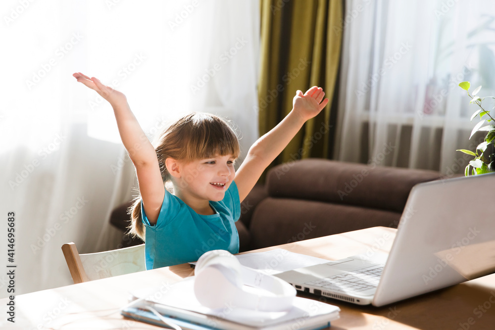 child girl is using a laptop and study online with video call teacher at home. homeschooling, distant learning child girl is using a laptop and study online with video call teacher at home. homeschooling, distant learning