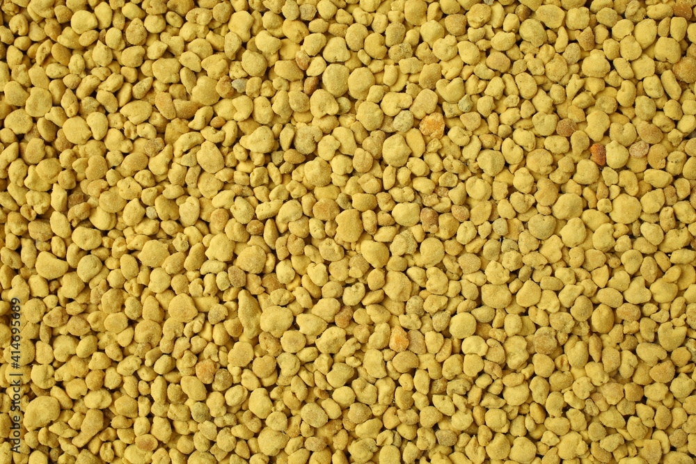 Golden bee pollen granules abstract background Golden bee pollen granules abstract background