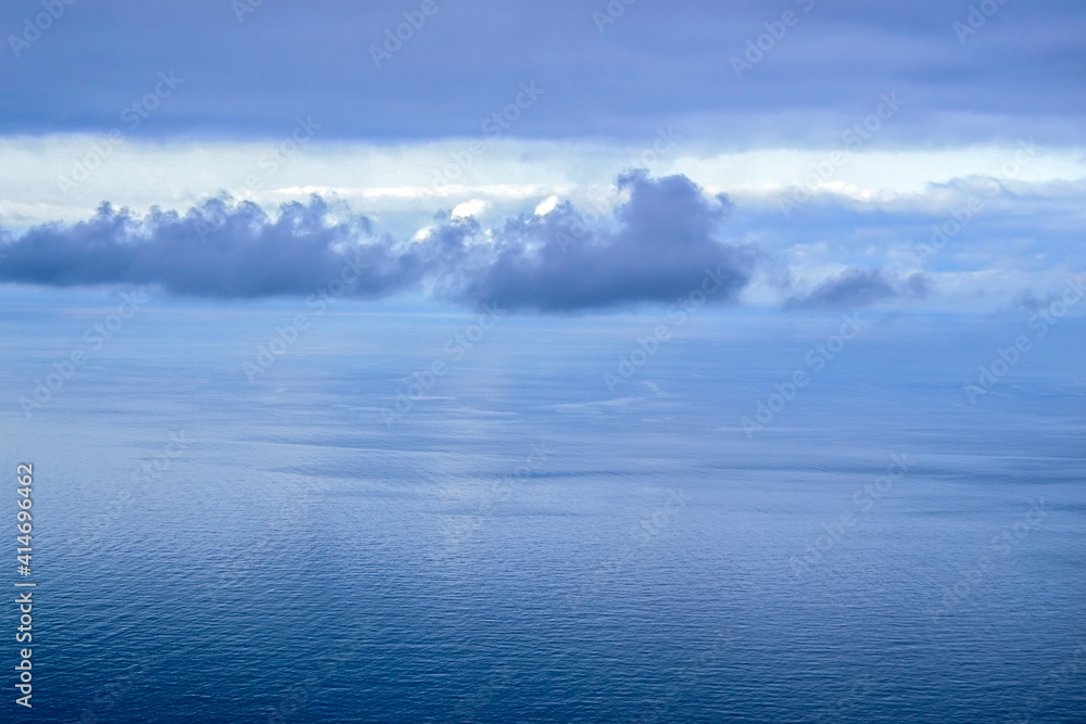 Blue clouds over the water surface.