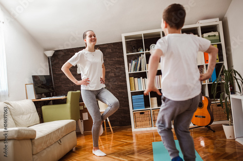 Children exercising at home. Family working out at home.