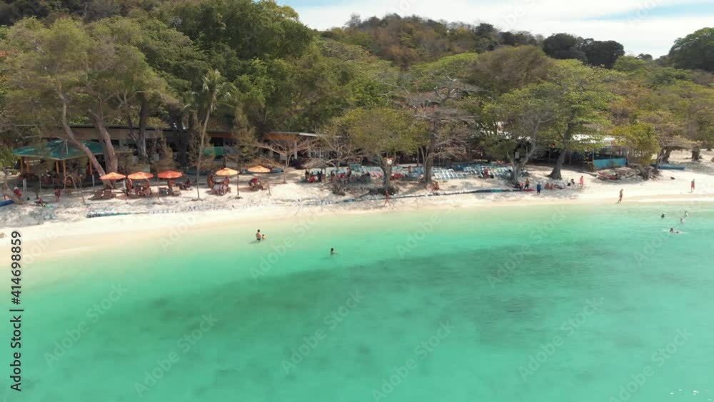Tourism rural resort escape with people enjoying the idyllic paradise in Koh Hey (Coral Island), Thailand - Aerial Orbit ascending shot Tourism rural resort escape with people enjoying the idyllic paradise in Koh Hey (Coral Island), Thailand - Aerial Orbit ascending shot