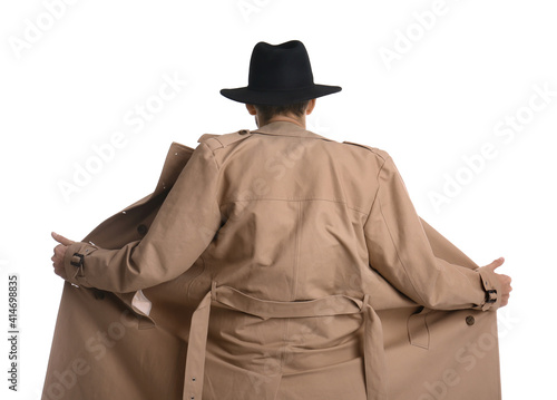Fototapeta Exhibitionist exposing naked body under coat isolated on white, back view