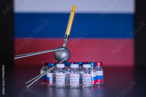 Group of russian vaccines named after a well-known russian satellite against Covid 19 virus with syringe. Tag text reads, corona virus injection only.