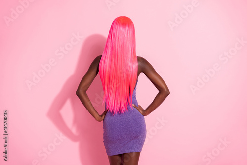 Fotografie, Obraz Photo portrait back view of african american woman with pink wig isolated on pas