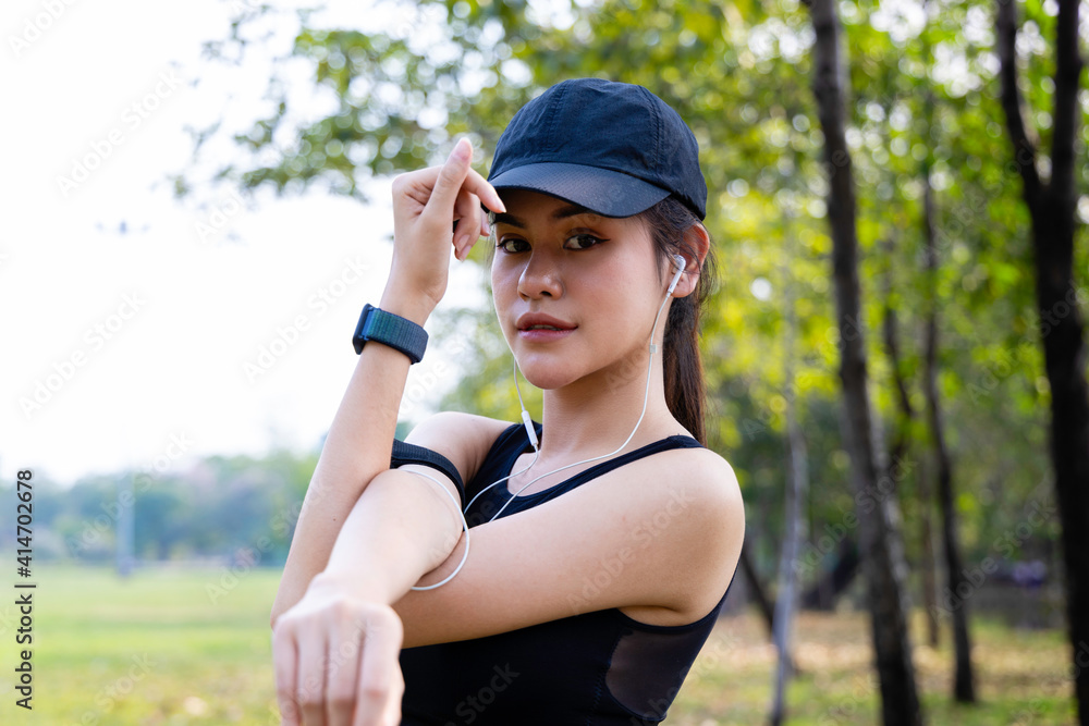 Asian young women stretching body warm up before workout outdoor. Asian young women stretching body warm up before workout outdoor.