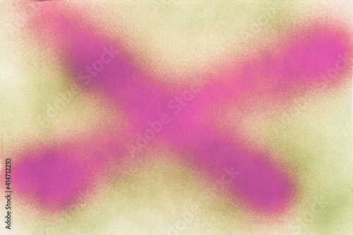 magenta x sign spray painted on green spray painted white paper background