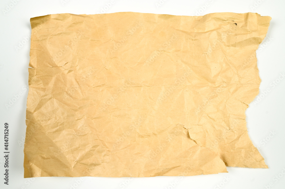 Yellow crumpled, torn paper on isolated white background