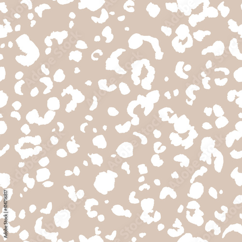Abstract modern leopard seamless pattern. Animals trendy background. Beige and white decorative vector stock illustration for print, card, postcard, fabric, textile. Modern ornament of stylized skin