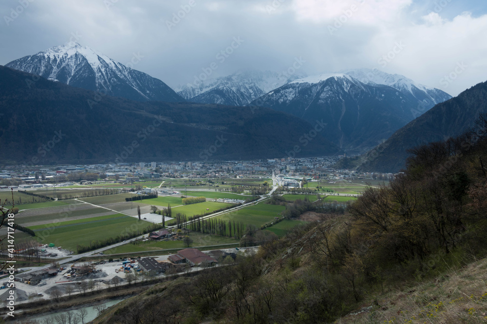 City of Martigny in the bend of the Rhône in Valais with play of light