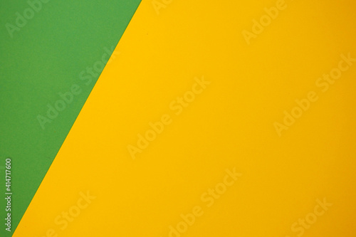 yellow background and green triangle on the left. background empty space