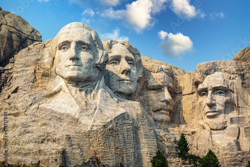 Mt. Rushmore National Memorial Park in South Dakota. Mount Rushmore National Memorial is centered on a colossal sculpture carved into the granite in the Black Hills in Keystone, South Dakota photo
