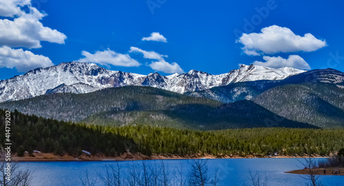 Panorama Snow-capped and forested mountains near a mountain lake, Pikes Peak Mountains in Colorado Spring, Colorado, US