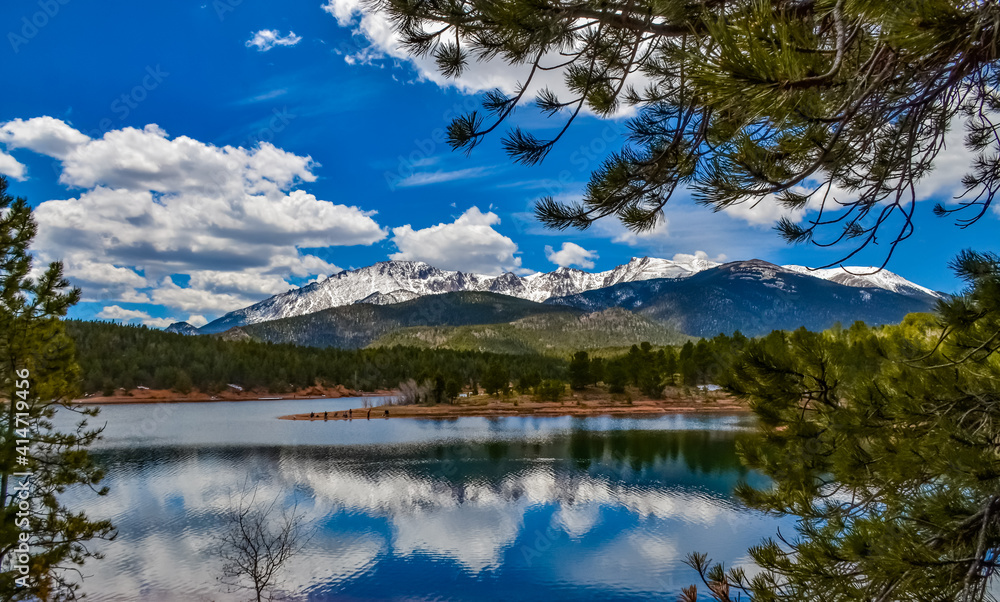 Panorama Snow-capped and forested mountains near a mountain lake, Pikes Peak Mountains in Colorado Spring, Colorado, US Panorama Snow-capped and forested mountains near a mountain lake, Pikes Peak Mountains in Colorado Spring, Colorado, US