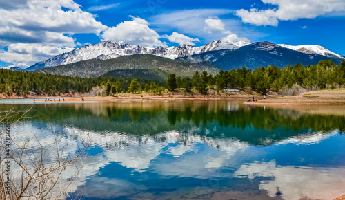 Panorama Snow-capped and forested mountains near a mountain lake, Pikes Peak Mountains in Colorado Spring, Colorado, US